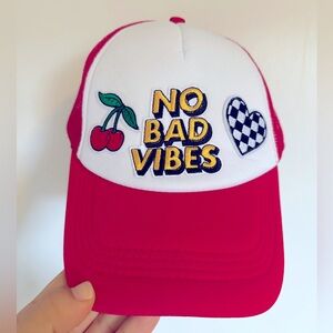 Red snapback trucker hat with patches